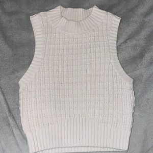 Cream colored sleeveless crop sweater